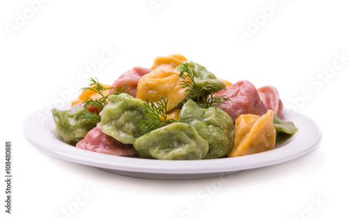Freshly made dumplings stuffed with meat on a white background