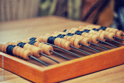 old abacus on the table in the room