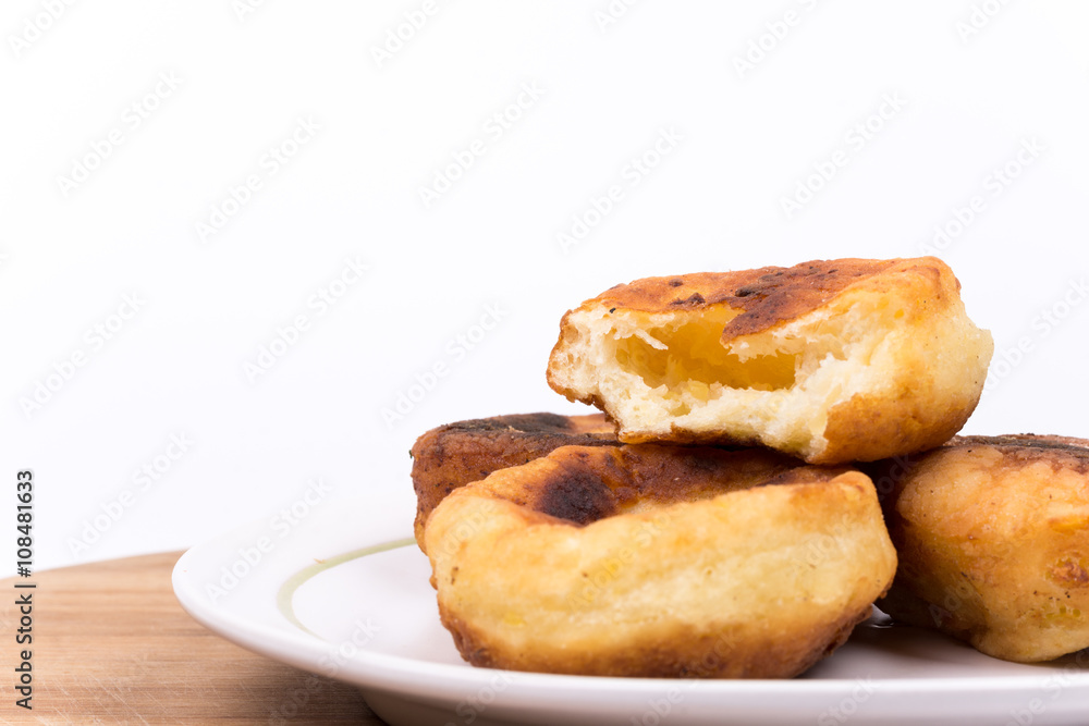 Homemade donuts with copy space over white background