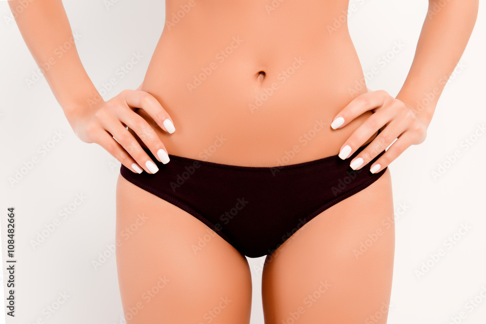 Close up photo of  black women's panties and slim belly