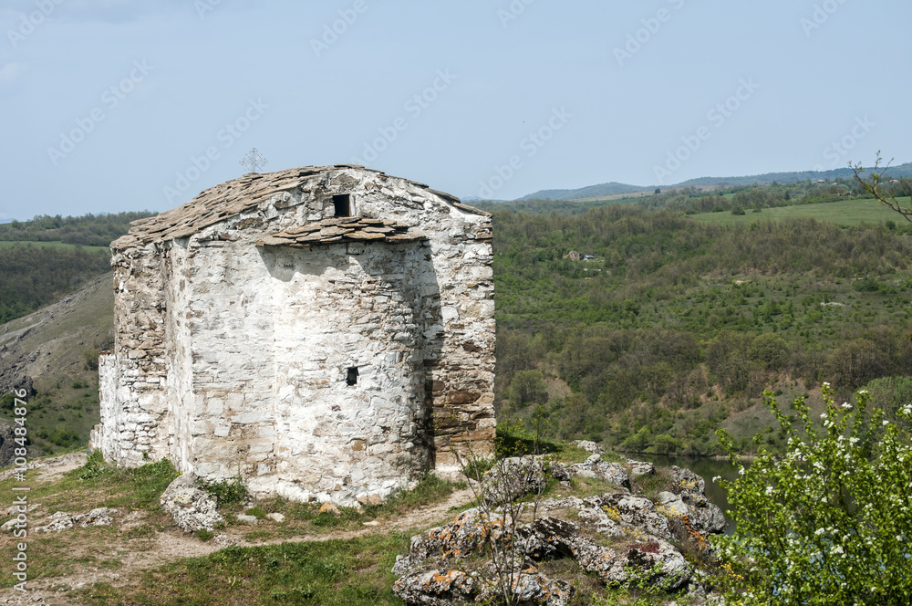 Medieval orthodox stone chapel from behind view