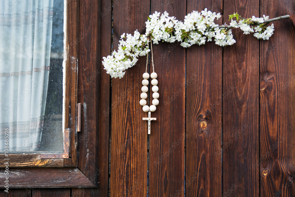 A wooden cross with coral A wooden cross with coral