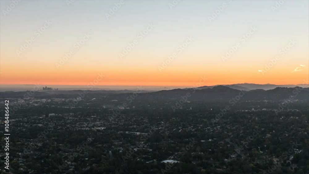 Los Angeles sunset to night hilltop view time lapse with zoom out. Los Angeles sunset to night hilltop view time lapse with zoom out.
