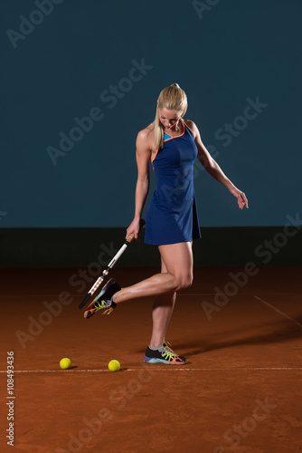 Woman With Tennis Racket And Tennis Balls