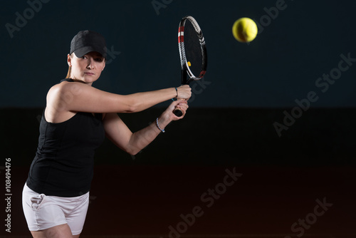 Tennis Player Hitting The Ball On Tennis Court © Jale Ibrak