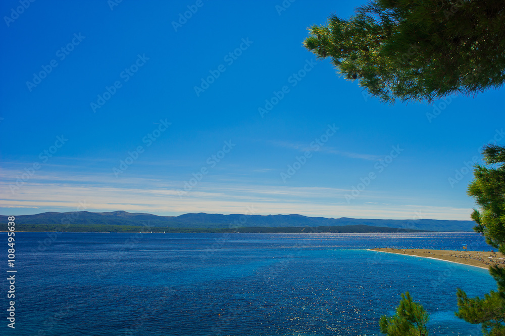 Beautiful seascape on Adriatic bay with yachts and Zlatni rat beach