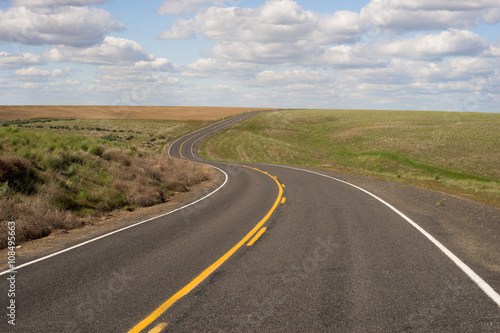 Paved Two Lane Road Highway Transportation White Clouds Blue Sky © Christopher Boswell
