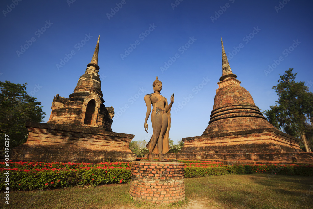 Fototapeta premium Buddha and pagodas Sukhothai Historical Park. Sukhothai, Thailand.