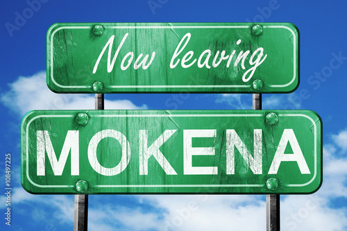 Leaving mokena, green vintage road sign with rough lettering photo
