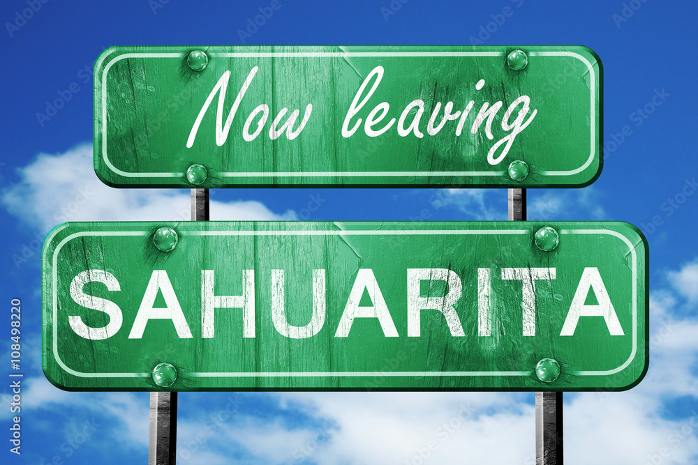 Leaving sahuarita, green vintage road sign with rough lettering