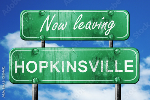 Leaving hopkinsville, green vintage road sign with rough letteri photo