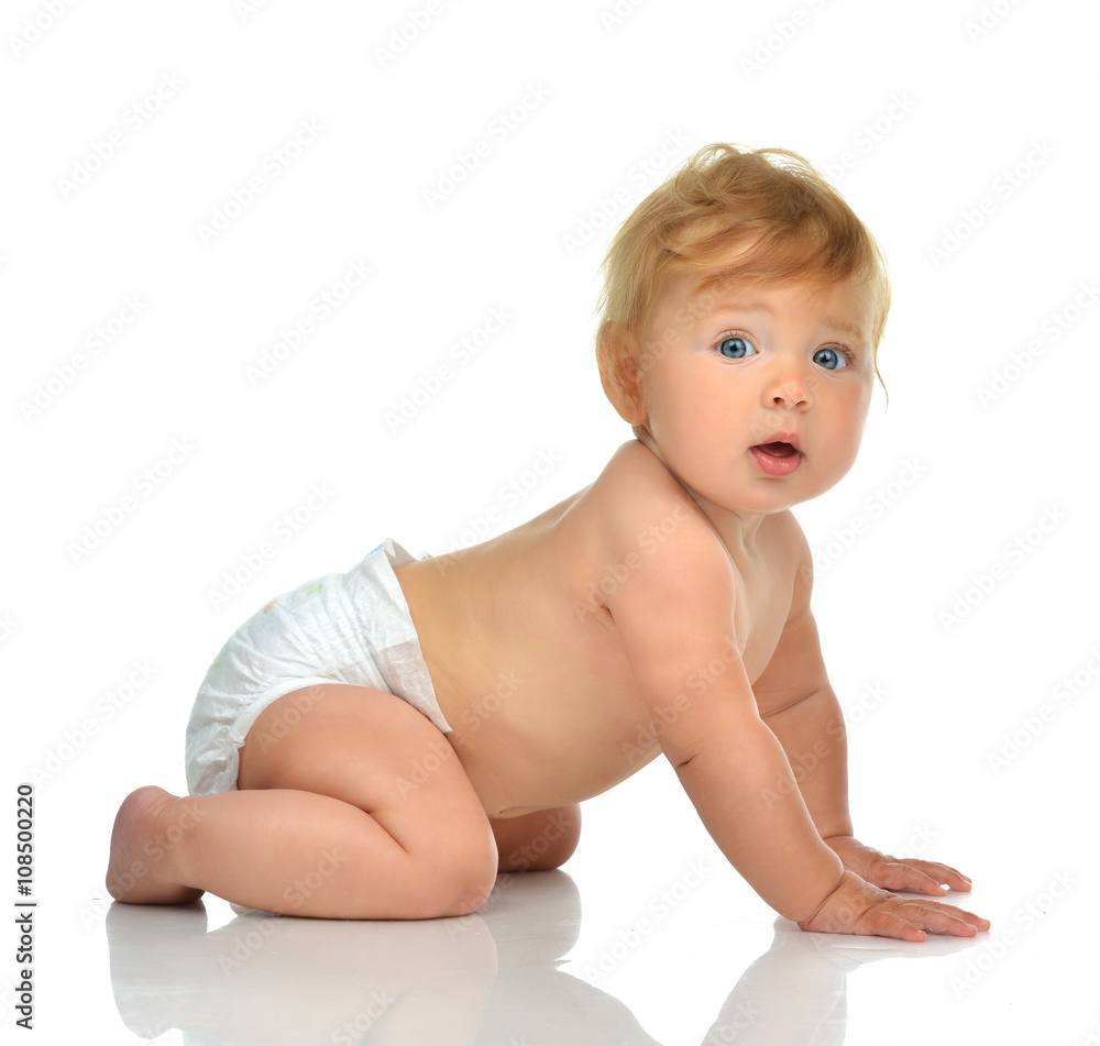 Infant child baby girl kid in diaper crawling happy looking at t