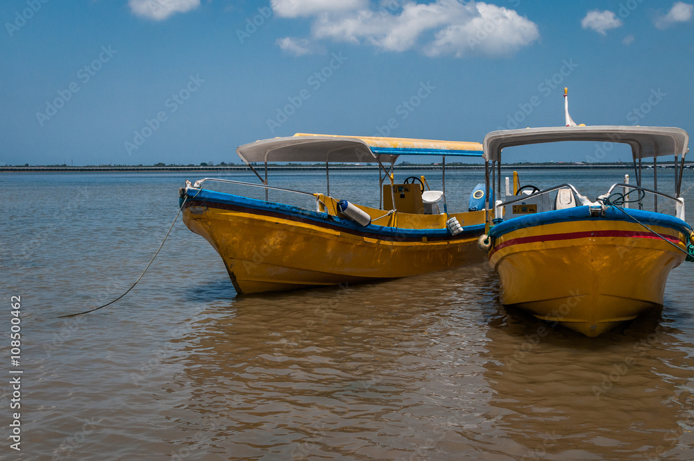 Two boats by the beach
