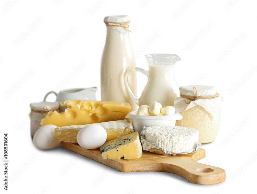 Set of fresh dairy products on wooden board,  isolated on white