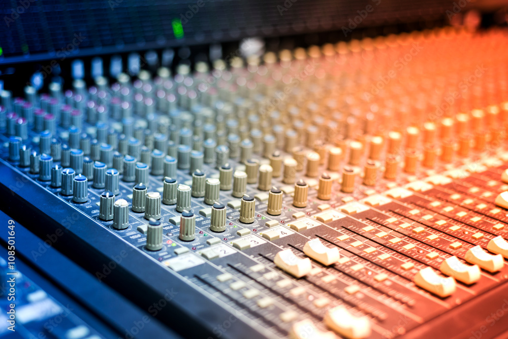 An Audio mixing table in soft light An Audio mixing table in soft light