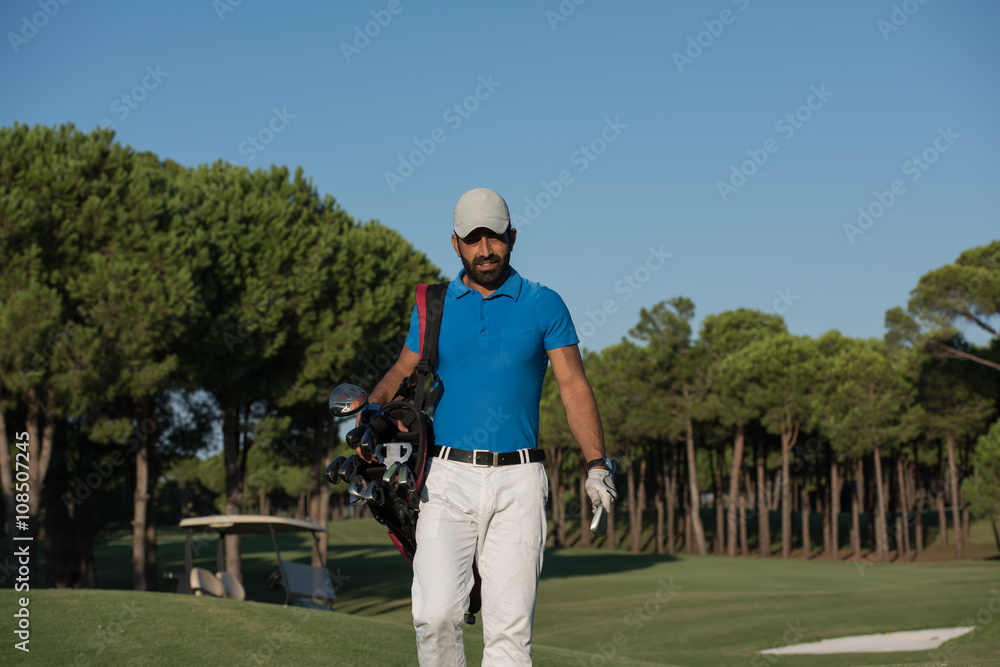 golfer walking and carrying golf bag golfer walking and carrying golf bag