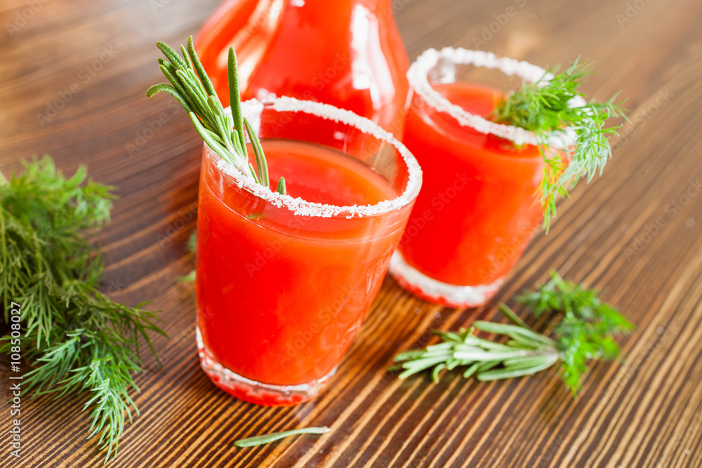tomato juice in glasses on a table, selective focus tomato juice in glasses on a table, selective focus
