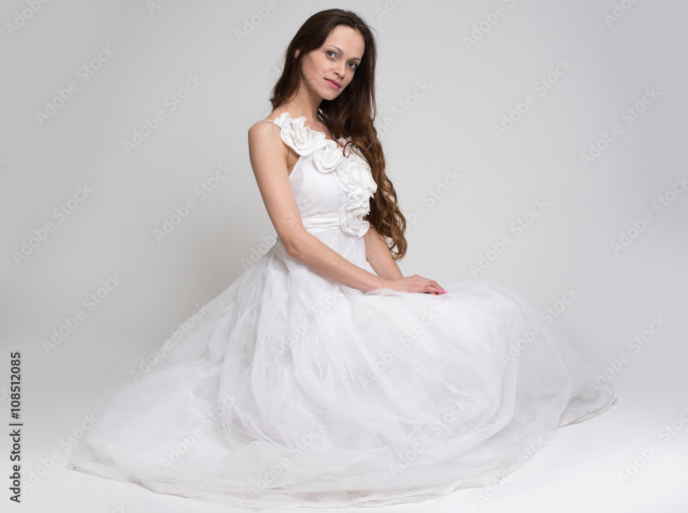 Sexy beautiful brunette woman in white dress Sexy beautiful brunette woman in white dress