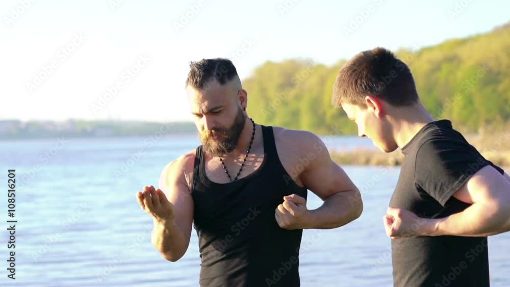 Practicing of wing chun with master outdoor. Slowly Practicing of wing chun with master outdoor. Slowly