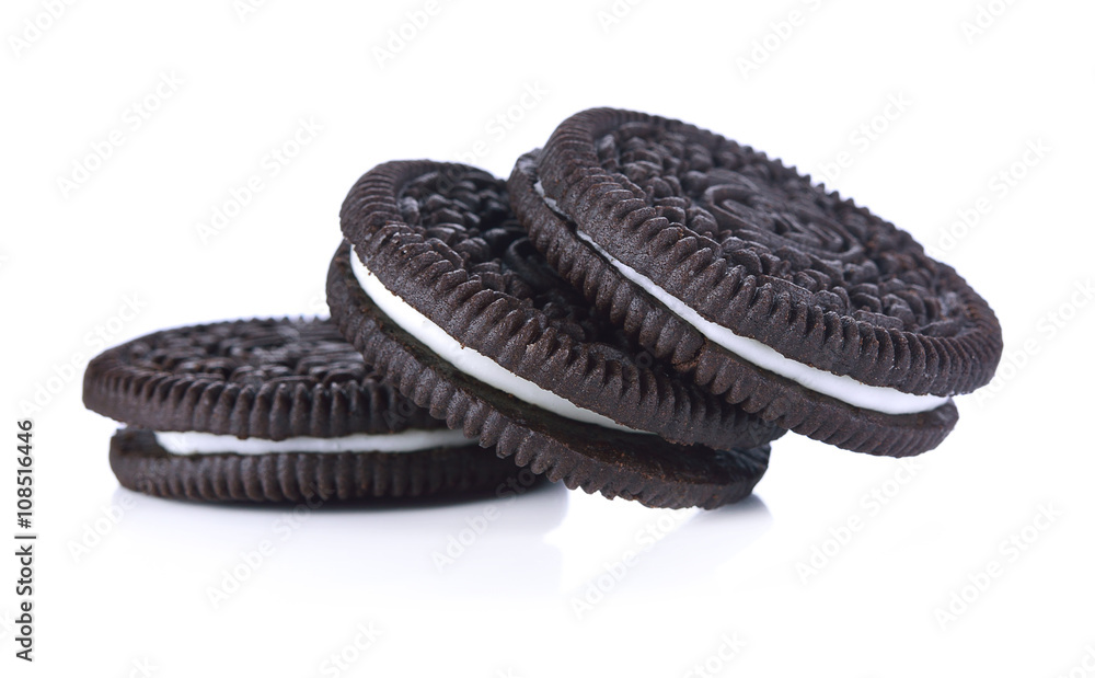 Chocolate cookies with cream filling tower isolated on white bac Chocolate cookies with cream filling tower isolated on white bac