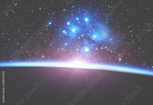 Fototapeta Naklejka Na Ścianę i Meble -  Planets and sunrise on a starry background. 