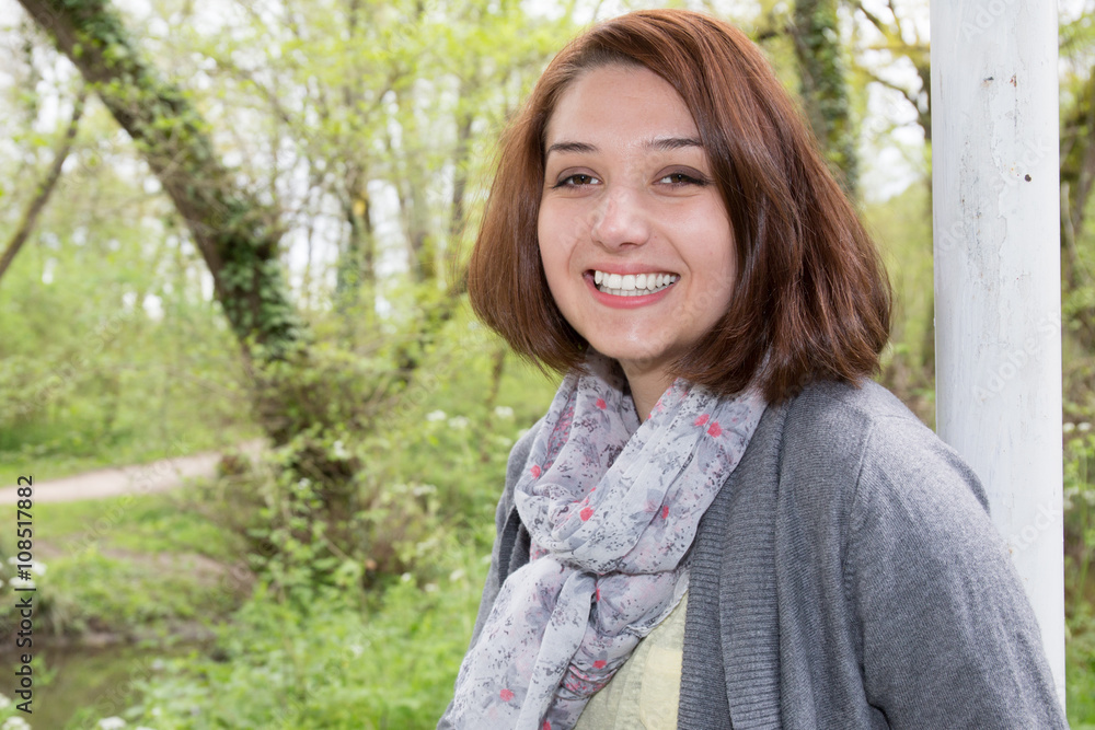 Cute and confident smiling girl looking at the camera Cute and confident smiling girl looking at the camera