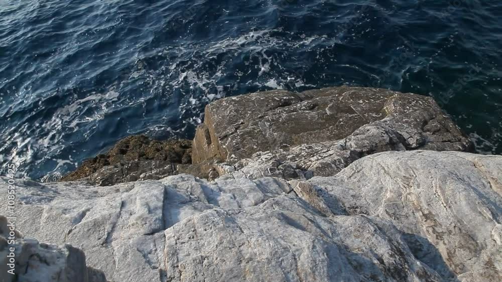 Sea water and rocks in Thassos island, Greece, next to the natural pool called Giola. Sound of waves and wind Sea water and rocks in Thassos island, Greece, next to the natural pool called Giola. Sound of waves and wind