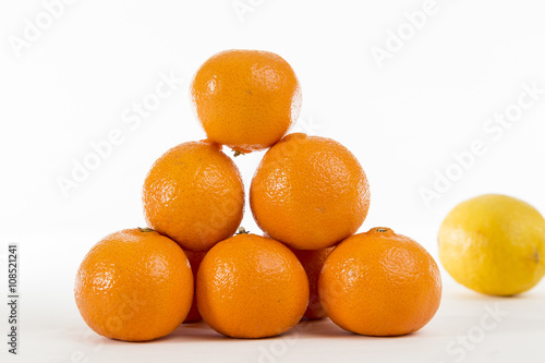 Bright Orange Clementines on a bright background