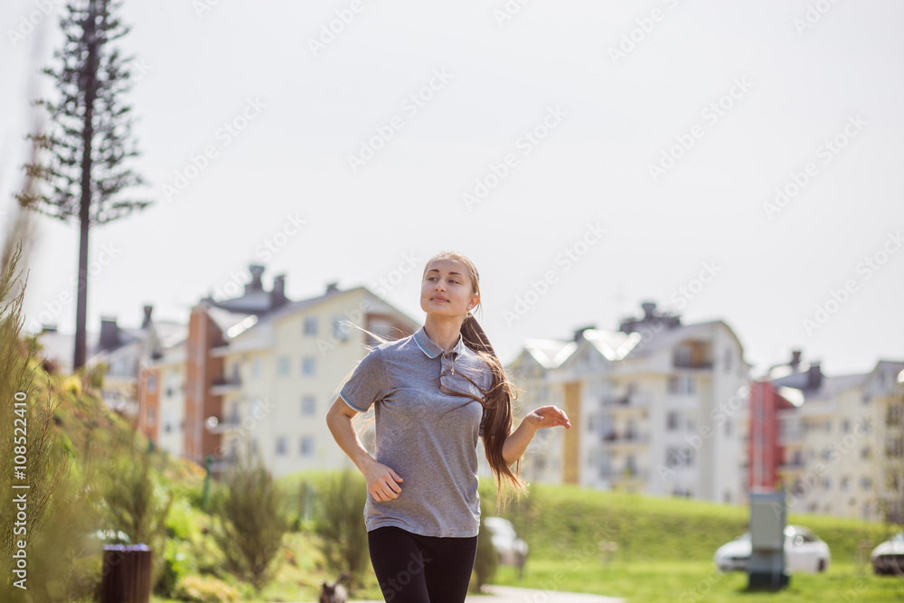 Fototapeta premium Photo of young blonde woman doing running activities