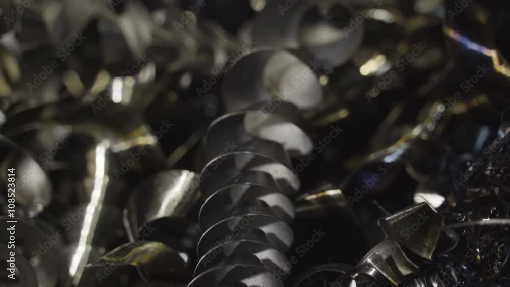 Small pieces of metals from the machine. The black pieces from the processed metals inside the steel company Small pieces of metals from the machine. The black pieces from the processed metals inside the steel company
