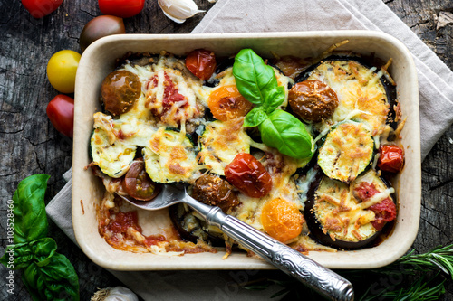 Eggplant,zucchini and tomato with mozzarella in Casserole photo