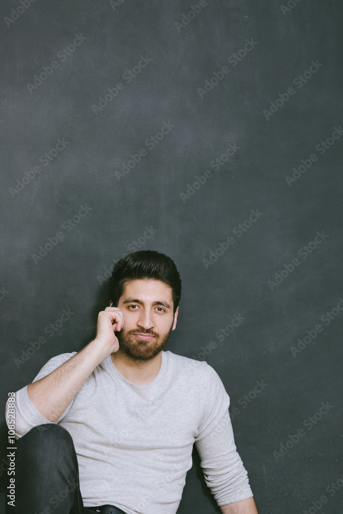 Casually handsome. Portrait of joyful young Arabic man standing