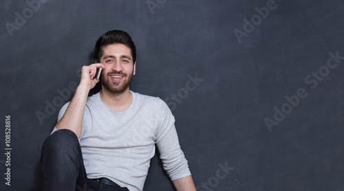 Casually handsome. Portrait of joyful young Arabic man standing