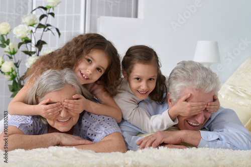 Happy senior couple with grandchildren