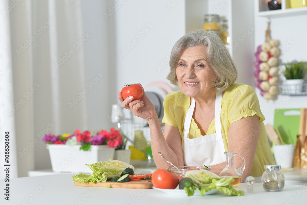 Senior woman cooking in kitchen