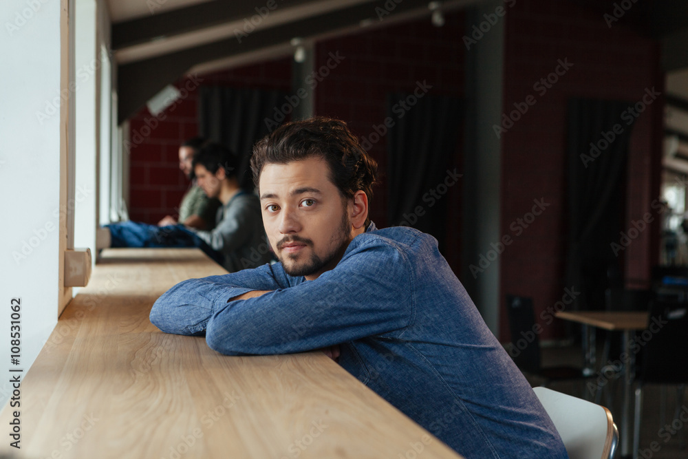 Fototapeta premium Man sitting at the table in office