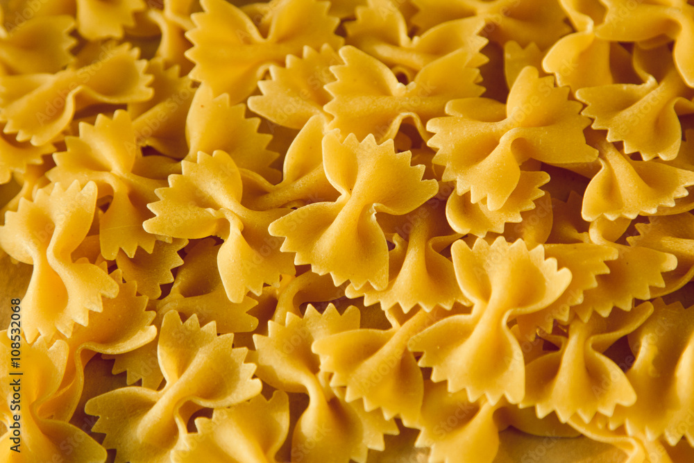 Beautiful background made of pasta ribbons on parchment paper Beautiful background made of pasta ribbons on parchment paper