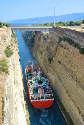 Tugboat and a vessel through Corinth canal