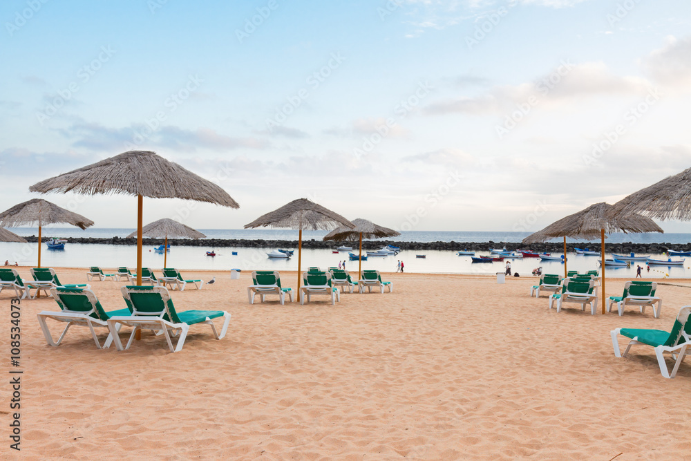 Beach with chairs and umbrellas
