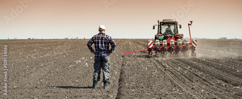 Work on field during soy planting time photo