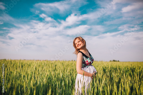 Wallpaper Mural A young pregnant woman in a wheat field Concept photo of pregnancy, pregnant woman Torontodigital.ca