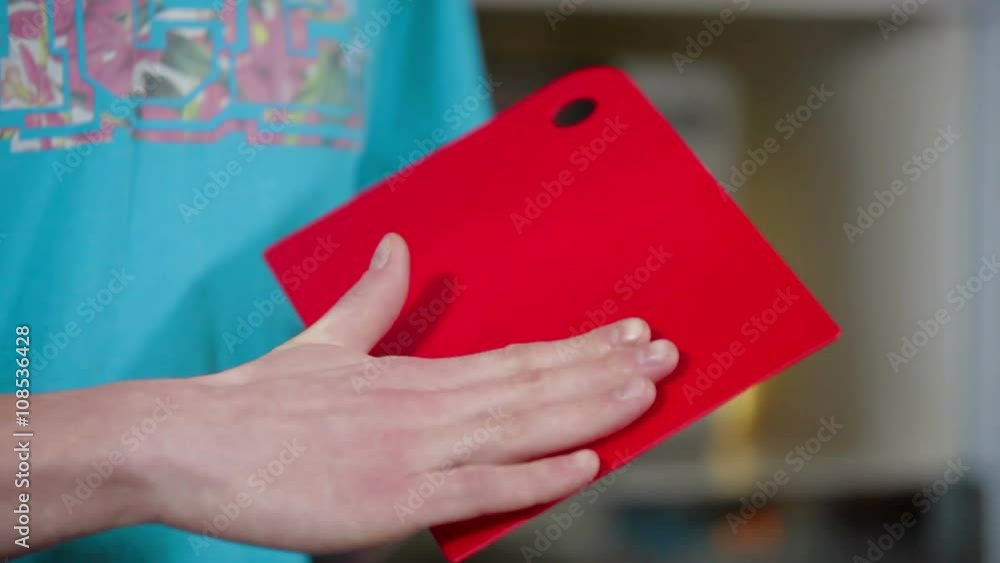 Male hand terting on cutting board music kitchen Male hand terting on cutting board music kitchen