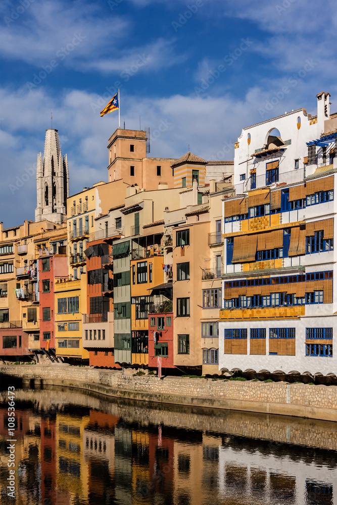 Colorful houses on Onyar River bank at sunset. Gerona, Spain.