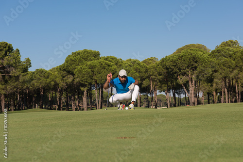 golf player aiming perfect shot