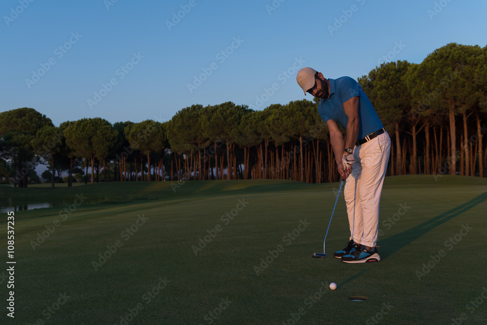 Fototapeta premium golfer hitting shot at golf course