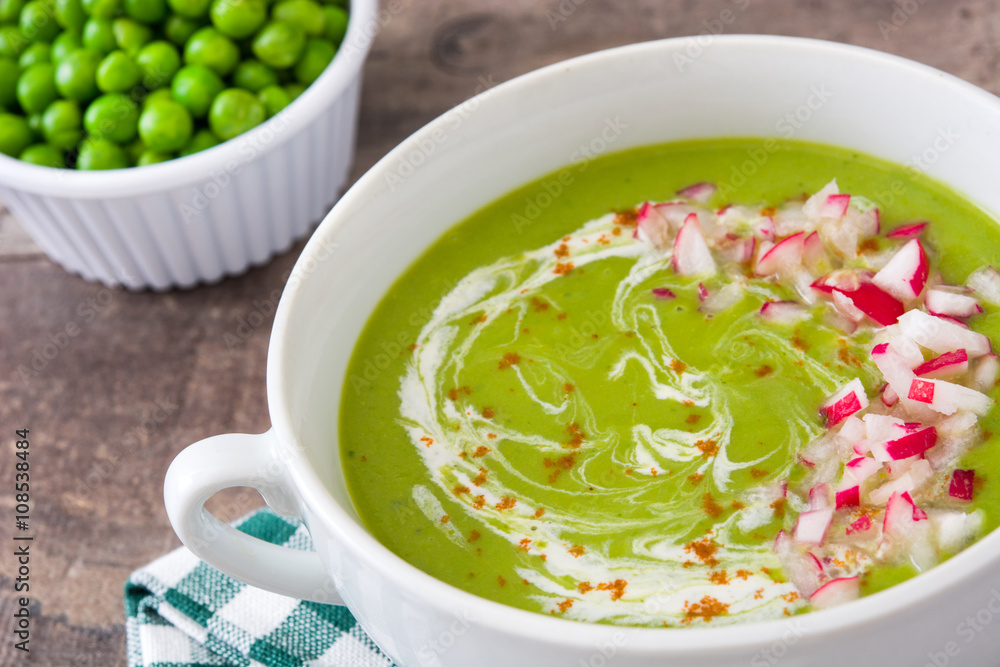 Peas cream with radishes on rustic wooden table
Peas cream with radishes on rustic wooden table
