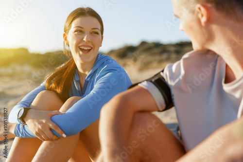 Couple in sport wear on beach