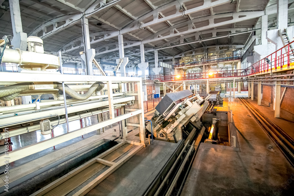 Fototapeta premium production facilities with automated machinery at factory producing blocks