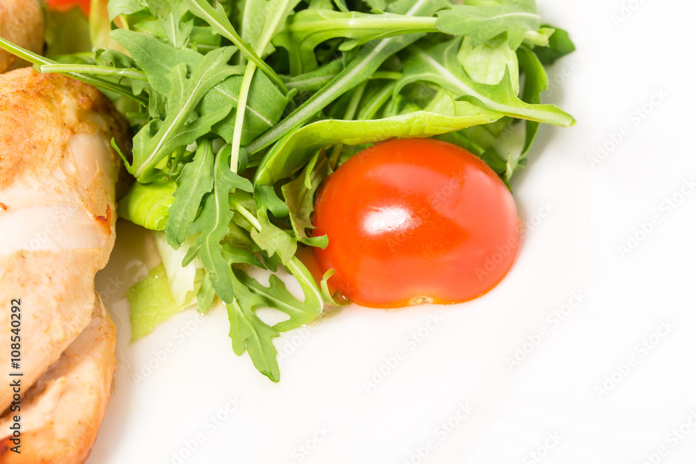 Grilled chicken fillet with tomatoes cherry.