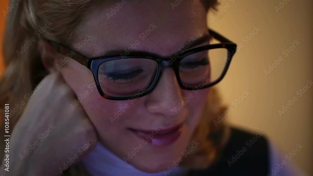 Happy smiling lady watching funny videos on laptop, enjoying evening after work Happy smiling lady watching funny videos on laptop, enjoying evening after work